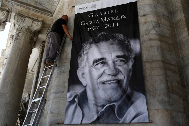 Worker arranges a banner with the picture of late Colombian Nobel Prize laureate Marquez at the Bellas Artes palace in Mexico City