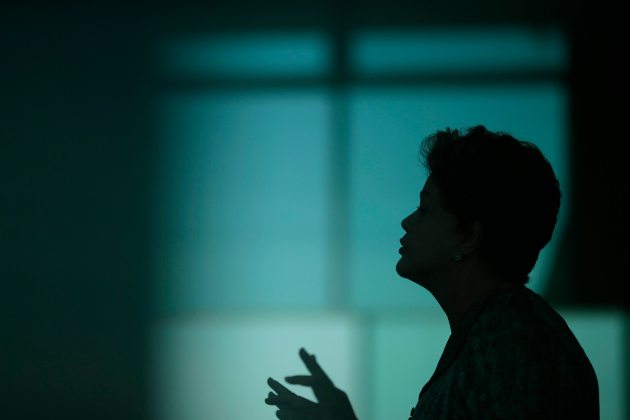 Brazil's President and Workers' Party (PT) presidential candidate Dilma Rousseff is silhouetted during a news conference at the Alvorada Palace in Brasilia