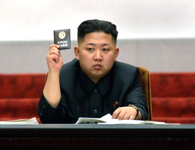 File photo shows North Korean leader Kim Jong-Un holding up his ballot during the fifth session of the 12th Supreme People's Assembly of North Korea in Pyongyang