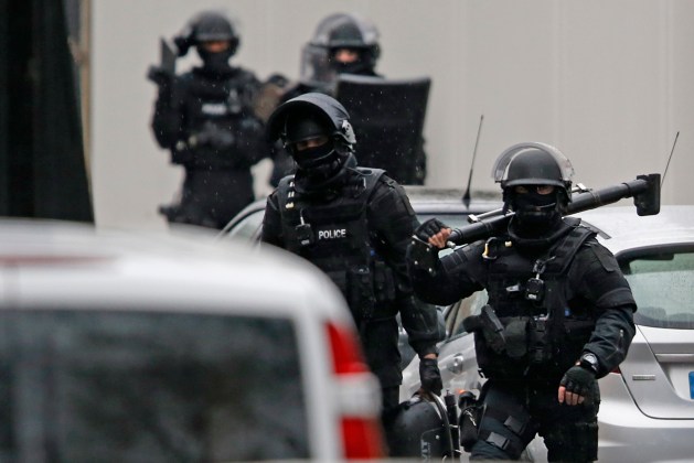 Members of French special police forces of Research and Intervention Brigade are seen at the scene of a shooting in the street of Montrouge near Paris