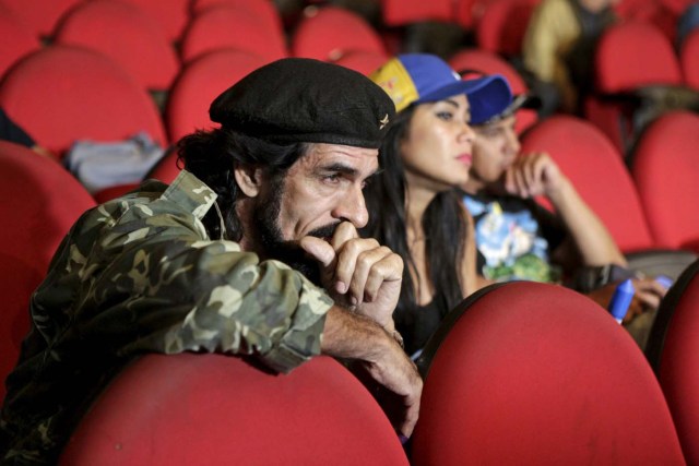 Humberto Lopez, known as "El Che", reacts as National Electoral Council (CNE) President Tibisay Lucena announces the official results of parliamentary elections in Caracas, December 7, 2015. Venezuela's opposition won control of the legislature from the ruling Socialists for the first time in 16 years on Sunday, giving them a long-sought platform to challenge President Nicolas Maduro. REUTERS/Marco Bello FOR EDITORIAL USE ONLY. NO RESALES. NO ARCHIVE.                      TPX IMAGES OF THE DAY
