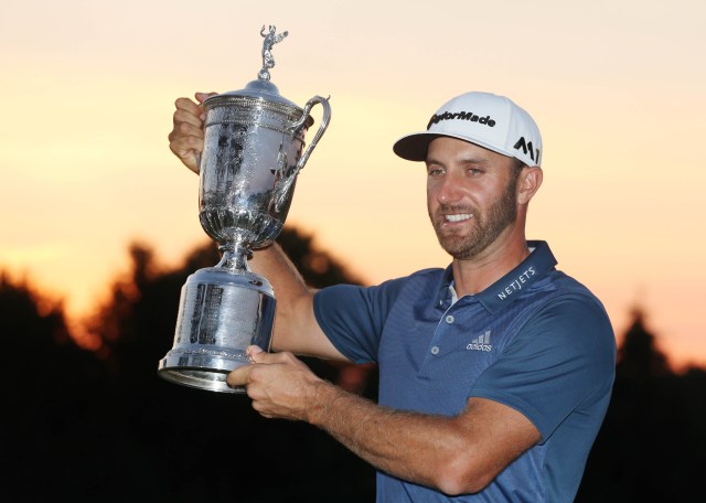 Jun 19, 2016; Oakmont, PA, USA; Dustin Johnson poses with the championship trophy after winning the U.S. Open golf tournament at Oakmont Country Club. Mandatory Credit: Charles LeClaire-USA TODAY Sports