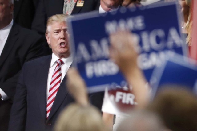 Republican U.S. presidential nominee Donald Trump stands in the Trump family box at the conclusion of former rival Republican U.S. presidential candidate Senator Ted Cruz's address during the third night of the Republican National Convention in Cleveland, Ohio, U.S. July 20, 2016.  REUTERS/Mark Kauzlarich