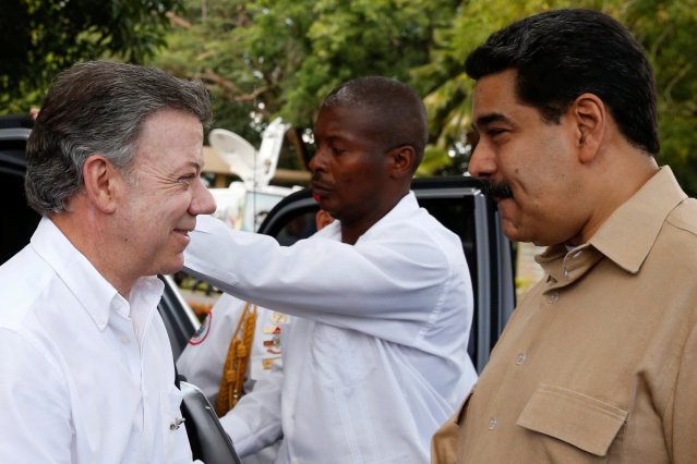 Venezuela's President Maduro and Colombia's President Santos smile during their meeting at Macagua Hydroelectric compound in Puerto Ordaz