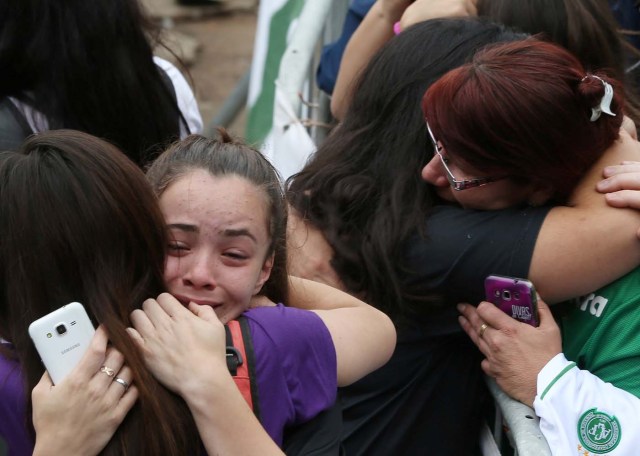 Fans of Chapecoense soccer team react in front of the Arena Conda stadium in Chapeco, Brazil, November 29, 2016. REUTERS/Paulo Whitaker