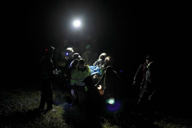 ATTENTION EDITORS - VISUAL COVERAGE OF SCENES OF INJURY OR DEATHRescue workers carry the body of a victim from a plane that crashed into Colombian jungle with Brazilian soccer team Chapecoense, is seen near Medellin, Colombia, November 29, 2016. REUTERS/Fredy Builes