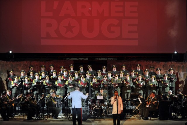 (FILES) This file photo taken on July 13, 2013 shows members of the Russian group, The Red Army Choir, performing at the opening of the 49th International Festival of Carthage at the Roman Theatre of Carthage. More than 60 members of the internationally-renowned Red Army Choir were on board a Russian military plane that crashed in the Black Sea on December 25, 2016, Russia's defence ministry said. A list of passengers and crew published by the ministry showed that 64 members of the Alexandrov Ensemble, the army's official musical group, and its conductor Valery Khalilov were on board the Tu-154 travelling to Syria to celebrate the New Year with Russian troops.  / AFP PHOTO / FETHI BELAID