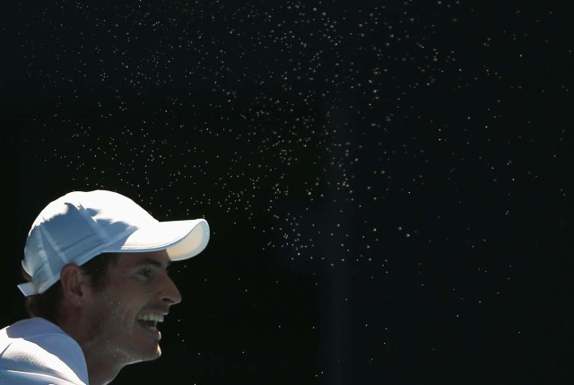 Tennis - Australian Open - Melbourne Park, Melbourne, Australia - 16/1/17 Sweat flies off Britain's Andy Murray during his Men's singles first round match against Ukraine's Illya Marchenko. REUTERS/Thomas Peter
