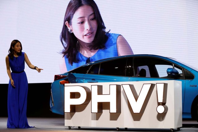 Japanese actress Satomi Ishihara demonstrates electric power supply system from Toyota Motor Corp.' Prius PHV Plug-in-Hybrid vehicle, also known as Prius Prime in the U.S., during an event to mark the launch of the car in Japan, in Tokyo, Japan February 15, 2017. REUTERS/Issei Kato