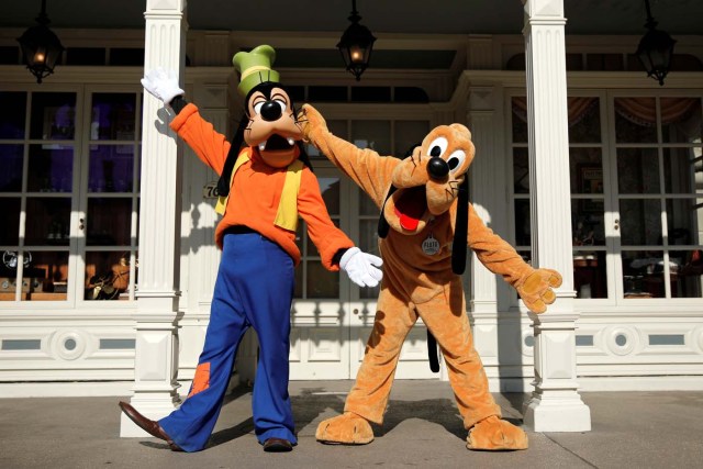 Disney characters Goofy and Pluto pose for photos in Disneyland Paris ahead of the 25th anniversary of the park in Marne-la-Vallee, near Paris, France, March 16, 2017. Picture taken March 16, 2017. REUTERS/Benoit Tessier