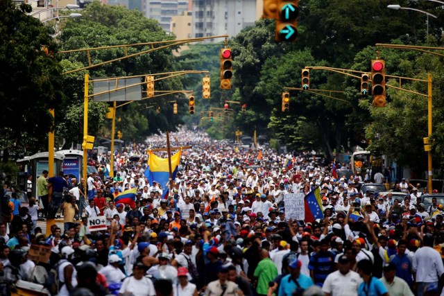 Demonstrators take part in a rally to honour victims of violence during a protest against Venezuela's President Nicolas Maduro's government in Caracas, Venezuela, April 22, 2017. REUTERS/Carlos Garcia Rawlins