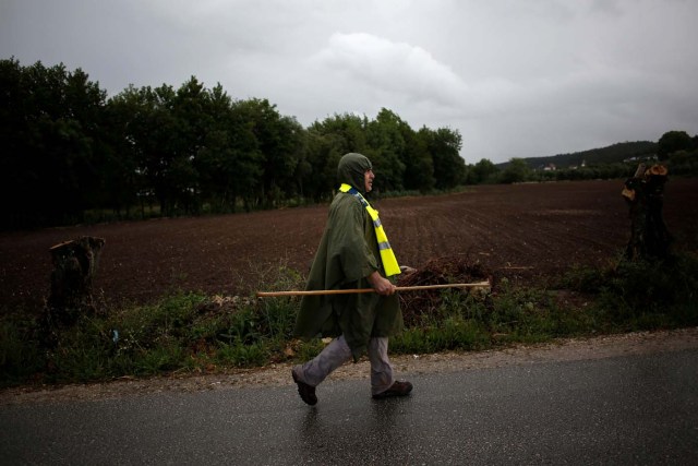 On the day before the arrival of Pope Francis, a pilgrim is seen on his way to Fatima, in Ourem, Portugal May 11, 2017. REUTERS/Pedro Nunes