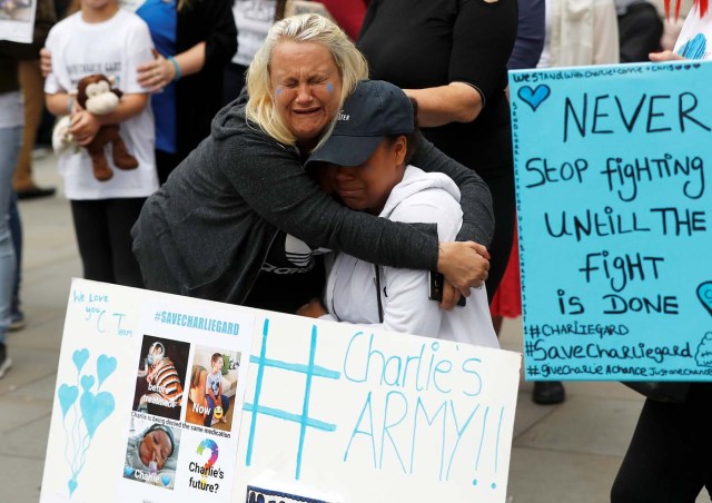Supporters of Charlie Gard's parents react outside the High Court during a hearing on the baby's future, in London, Britain July 24, 2017. REUTERS/Peter Nicholls