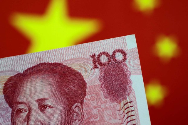 FILE PHOTO: A China yuan note is seen in this illustration photo May 31, 2017.     REUTERS/Thomas White/Illustration/File Photo