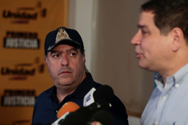 Julio Borges (L), president of the National Assembly and lawmaker of the Venezuelan coalition of opposition parties (MUD) looks on as his fellow lawmaker Luis Florido talks to the media during a news conference in Caracas, Venezuela, September 16, 2017. REUTERS/Marco Bello