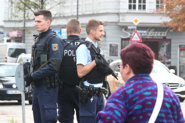 German police officers guard the site where earlier a man injured several people in a knife attack in Munich, Germany, October 21, 2017.