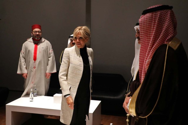 Brigitte Macron, the wife of the French president and Moroccan King Mohammed VI (L) visit the Louvre Abu Dhabi Museum during its inauguration in Abu Dhabi, UAE, November 8, 2017. Picture taken November 8, 2017. REUTERS/Ludovic Marin/Pool
