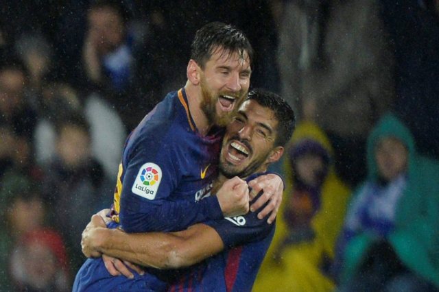 Lionel Messi y Luis Suárez. REUTERS/Vincent West