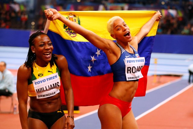 Athletics - IAAF World Indoor Championships 2018 - Arena Birmingham, Birmingham, Britain - March 3, 2018 Venezuela's Yulimar Rojas celebrates winning the Women’s Triple Jump Final with Jamaica's Kimberly Williams who won silver REUTERS/Phil Noble