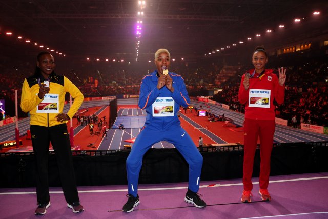 Athletics - IAAF World Indoor Championships 2018 - Arena Birmingham, Birmingham, Britain - March 3, 2018   Venezuela's Yulimar Rojas, Jamaica's Kimberly Williams and Spain's Ana Peleteiro pose with their respective gold, silver and bronze medals after the women’s triple jump final medal ceremony   REUTERS/Hannah McKay