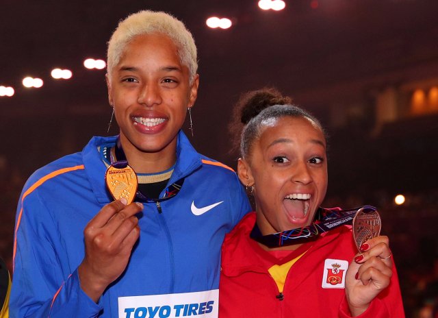 Athletics - IAAF World Indoor Championships 2018 - Arena Birmingham, Birmingham, Britain - March 3, 2018   Venezuela's Yulimar Rojas and Spain's Ana Peleteiro pose with their respective gold and bronze medals after the women’s triple jump final medal ceremony   REUTERS/Hannah McKay