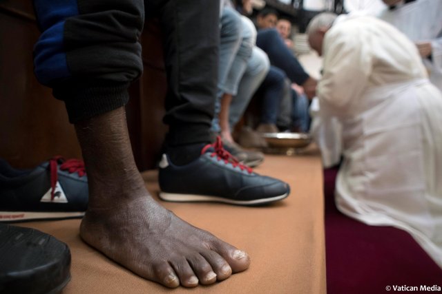 Pope Francis washes the foot of a inmate at the Regina Coeli prison during the Holy Thursday celebration in Rome, Italy, March 29, 2018. Osservatore Romano/Handout via REUTERS ATTENTION EDITORS - THIS IMAGE WAS PROVIDED BY A THIRD PARTY