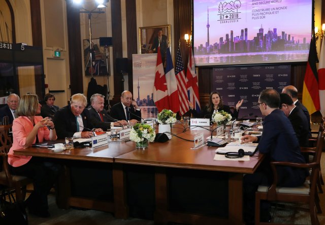 Canada's Minister of Foreign Affairs Chrystia Freeland is joined by France's Minister of Europe and Foreign Affairs Jean-Yves Le Drian, Acting U.S. Secretary of State John J. Sullivan, Britain's Foreign Secretary Boris Johnson, High Representative for the European Union's Foreign Affairs Federica Mogherini, Italy's Minister of Foreign Affairs Angelino Alfano, Japan's Minister of Foreign Affairs Taro Kono and Minister of Foreign Affairs for Germany Heiko Maas at opening remarks on the first day of foreign ministers meetings from G7 countries in Toronto, Ontario, Canada April 22, 2018. REUTERS/Fred Thornhill