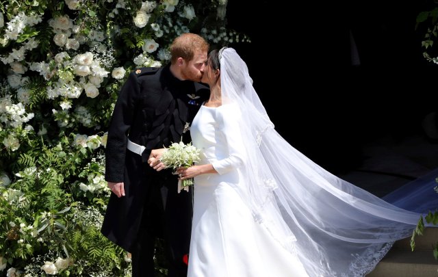 Prince Harry and Meghan Markle leave St George's Chapel in Windsor Castle after their wedding. in Windsor, Britain, May 19, 2018. Andrew Matthews/Pool via REUTERS